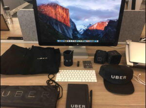 welcome kit for new team members, Facebook includes a branded mouse, T-Shirt, and two notebooks.