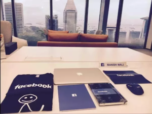 reusable tote, bottle of wine, small and large notebook, and a branded team T-Shirt for their new hires.